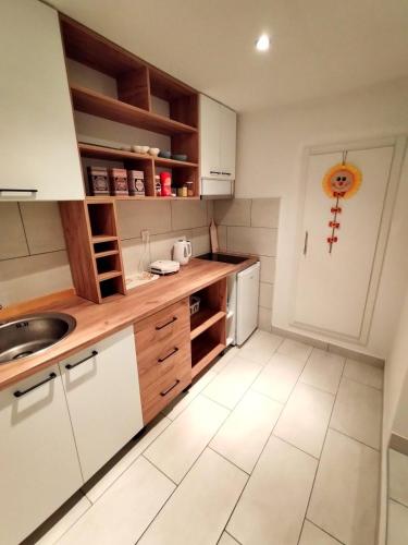 Kuchyň nebo kuchyňský kout v ubytování Apartman Magic moments Stari Grad