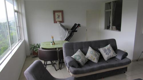 a living room with a couch and a table at Quinta Divina Providencia in Fusagasuga