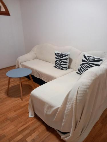 a living room with a couch and a bed and a table at Maris in Banjole