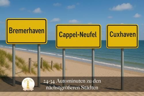 four yellow signs in front of the beach at Jontes Nest - Modern, gemütlich mit Sauna in Cappel-Neufeld