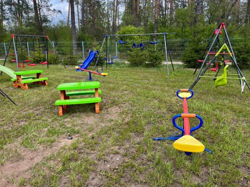 a group of playground equipment in a field at Gościniec Wigry 2 in Walne