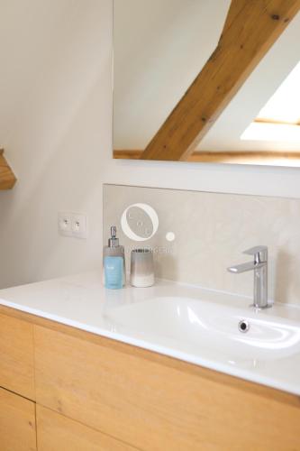 a bathroom with a sink and a mirror at COC - Villa La Finca in Audembert