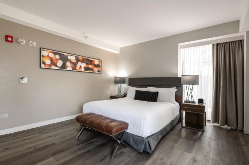 a hotel room with a bed and a window at Godfrey Hotel Chicago in Chicago