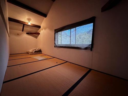 a room with a window and a room with mats at Itoshima - House - Vacation STAY 19051 in Itoshima