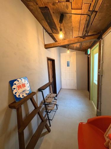 a room with chairs and a wooden ceiling at Sakaeya - Vacation STAY 76435v in Oshima