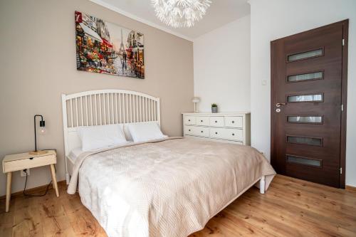Ένα ή περισσότερα κρεβάτια σε δωμάτιο στο Apartman Harmónia