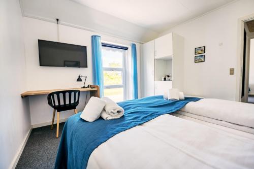 Postel nebo postele na pokoji v ubytování Hotel Hvideklit