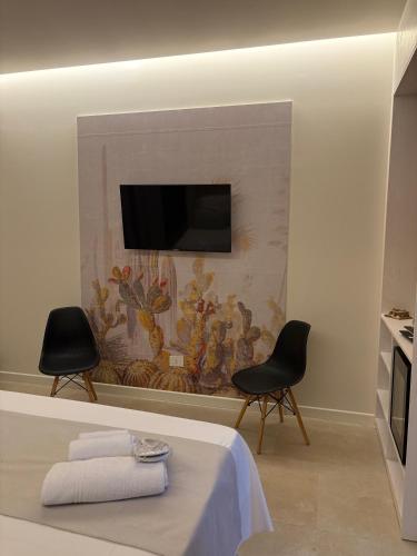 TV a/nebo společenská místnost v ubytování Sunset Beach Club Tropea