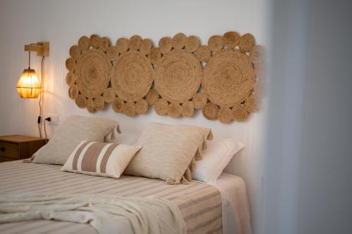 a bedroom with a bed with two pillows at Il Casale nel Parco in Ostuni