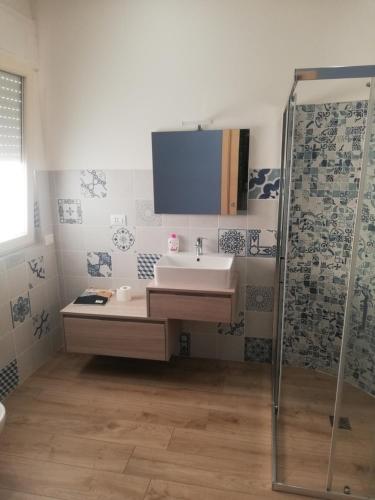 a bathroom with a sink and a shower at Casa vacanze Tenuta Camilli in Anzio