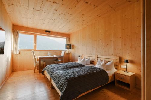 Una cama o camas en una habitación de Chalet Christl Panorama Appartements