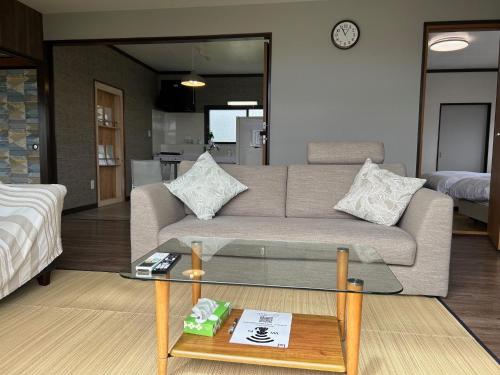 a living room with a couch and a table at AtreyuーAO - Vacation STAY 35828v in Teshikaga