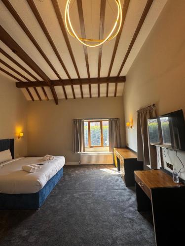 a room with a bed and a large window at Staindrop Hotel in Sheffield