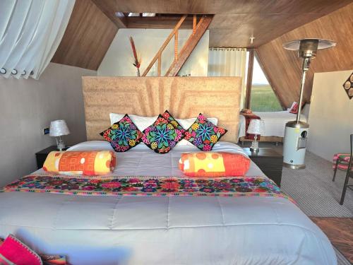 Postel nebo postele na pokoji v ubytování Suma inti lodge