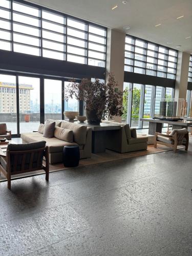 a living room with a couch and tables in a building at Luxury Apartment on Reforma in Mexico City