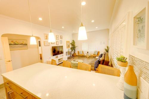 a kitchen and living room with a white counter top at 1000#1 Contemporary Home w/ Parking, Grill, & AC! in Newport Beach