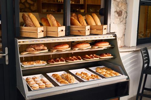 a display case filled with lots of different types of pastries at Colentum Resort Murter in Murter