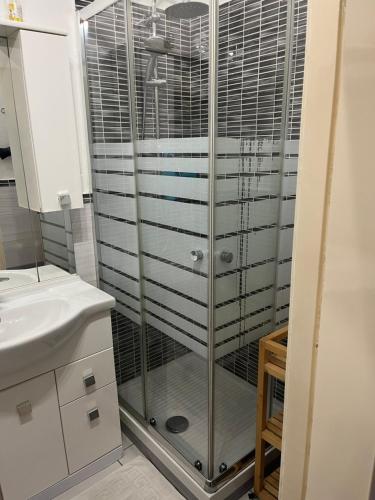 a bathroom with a shower and a sink at La casa di RO in Uscio