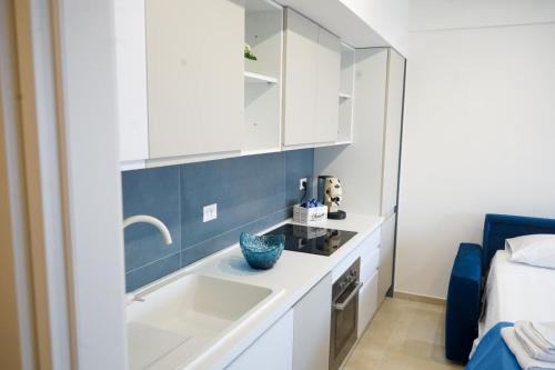a bathroom with a sink and a bed at Terracina Seaside Apartments in Lido Di Fondi