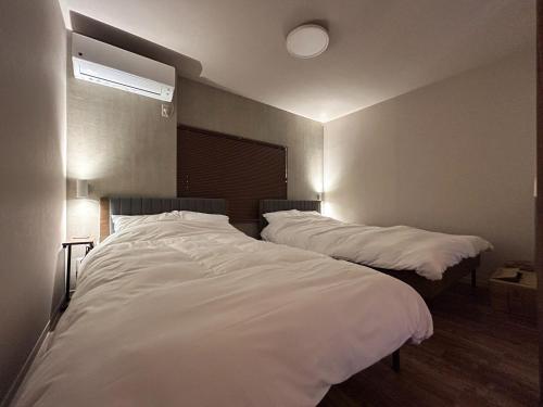 En eller flere senge i et værelse på Maison Yotsukuro - Vacation STAY 36360v