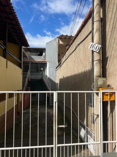 a stairway leading up to a building with a fence at Recanto da Serra in Miguel Pereira