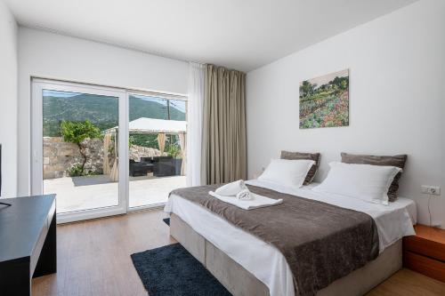En eller flere senge i et værelse på Villa ANKICA