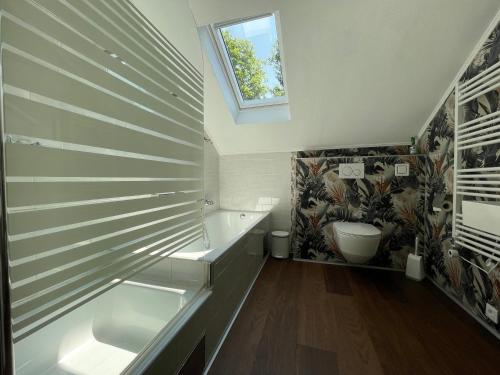 a bathroom with a sink and a window at Haus Silverfern in Förolach