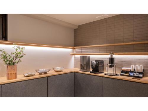 a kitchen with aasteryasteryasteryasteryasteryasteryasteryasteryasteryasteryasteryastery at Sun Hotel Fukuyama - Vacation STAY 53433v in Fukuyama
