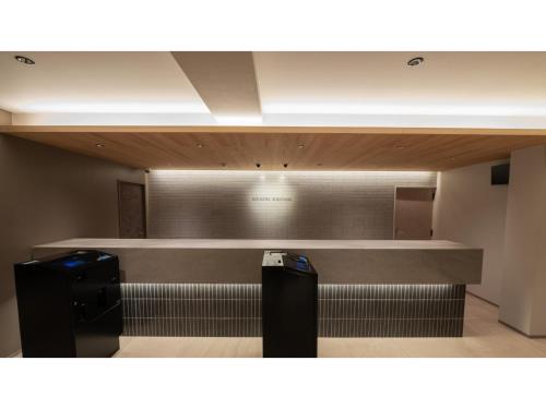 a waiting room with two trash at Sun Hotel Fukuyama - Vacation STAY 53433v in Fukuyama