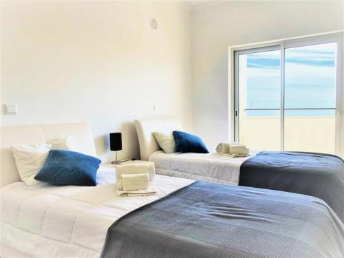 En eller flere senge i et værelse på Lagos Stunning Apartments