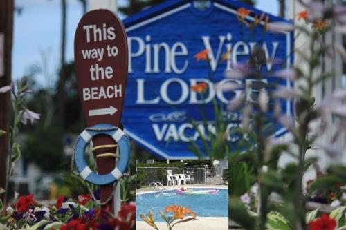 a sign for a swimming pool at a theme park at Pine View Lodge Old Orchard Beach in Old Orchard Beach