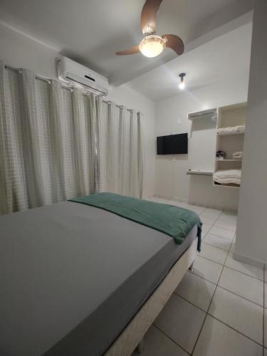 Ένα ή περισσότερα κρεβάτια σε δωμάτιο στο Apartamento em Cacoal - centro