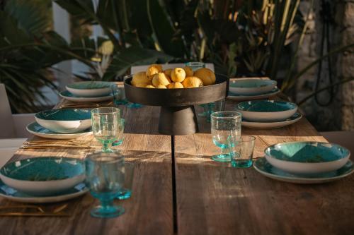 a table with a bowl of food on top of it at Kuzulu Beach House, Your Private Paradise in Plaka, Naxos in Plaka