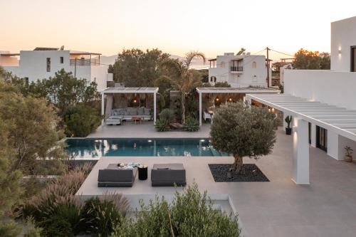 an aerial view of a house with a swimming pool at Kuzulu Beach House, Your Private Paradise in Plaka, Naxos in Plaka