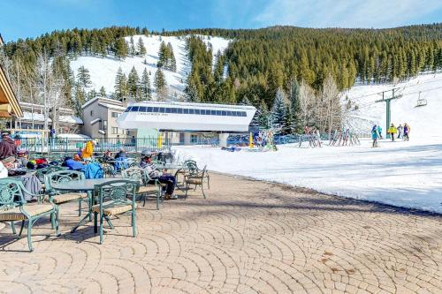 a group of people sitting at tables at a ski resort at Edelweiss Ski-In-N-Out & Unwind on Picabo St in Ketchum