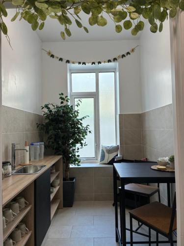 a kitchen with a table and a window at Carrick Gate in Carrick