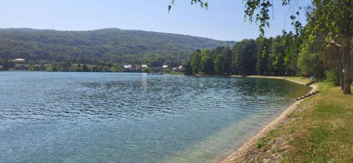 a lake with a fountain in the middle of it at Lumaris in Ogulin