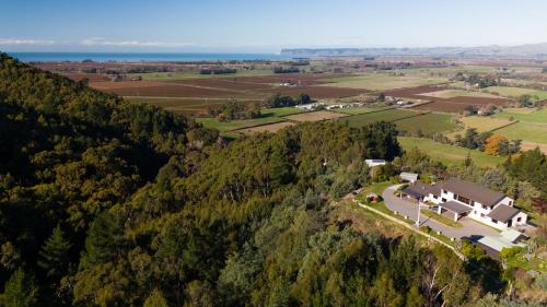 an aerial view of a house on a hill at Treetops in Blenheim