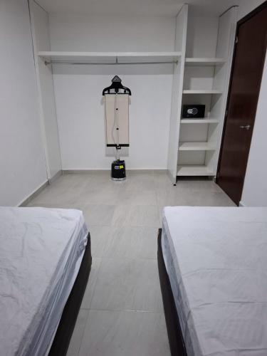 Postel nebo postele na pokoji v ubytování BUSINESS CLASS Departamentos