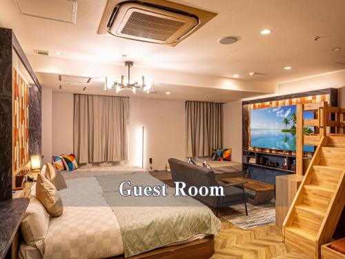 a guest room with a bed and a couch at Hotel Balian Resort Shinjuku Honten in Tokyo
