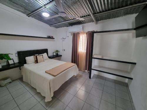 Postel nebo postele na pokoji v ubytování Villas La Vista