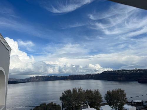 a view of a large body of water at Acrothea Suites and Villas - Akrotiri Caldera - Santorini in Akrotiri