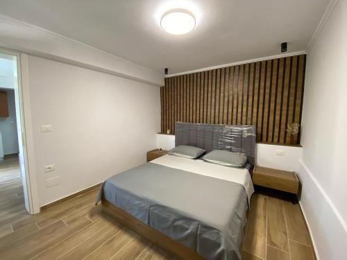 A bed or beds in a room at Valet e pushimit
