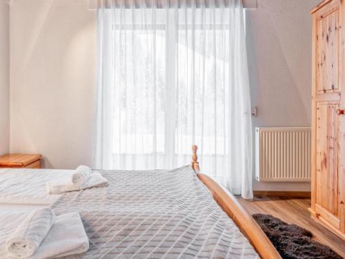 Ένα ή περισσότερα κρεβάτια σε δωμάτιο στο Haus Sonnberg