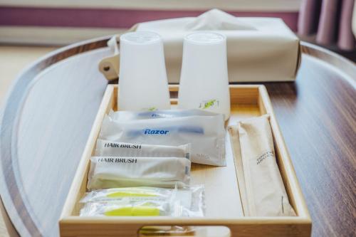 a wooden box on a table with towels on it at 伊豆集 Episode IZU in Ito