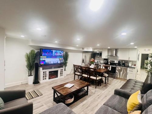 a living room with a couch and a dining room at ComfiNook Stay in Capitol HillWalk to DC Sites in Washington, D.C.