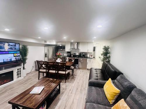 a living room with a couch and a table at ComfiNook Stay in Capitol HillWalk to DC Sites in Washington, D.C.