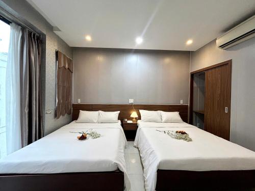 Postel nebo postele na pokoji v ubytování BeSea Hotel