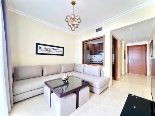 a living room with a couch and a table at Coastal Elegance - Bella Vista in Cabo Negro
