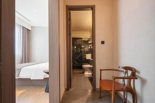 Cama o camas de una habitación en Mudita Hotel 观己酒店